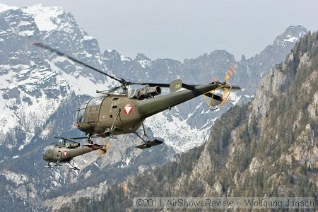 Sud-Aviation 316B Alouette III over the mountains.